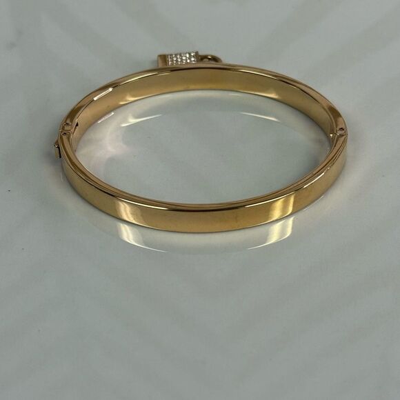 Michael Kors Goldtone Iconic Pace Lock Hinged Bracelet - Picture 6 of 7